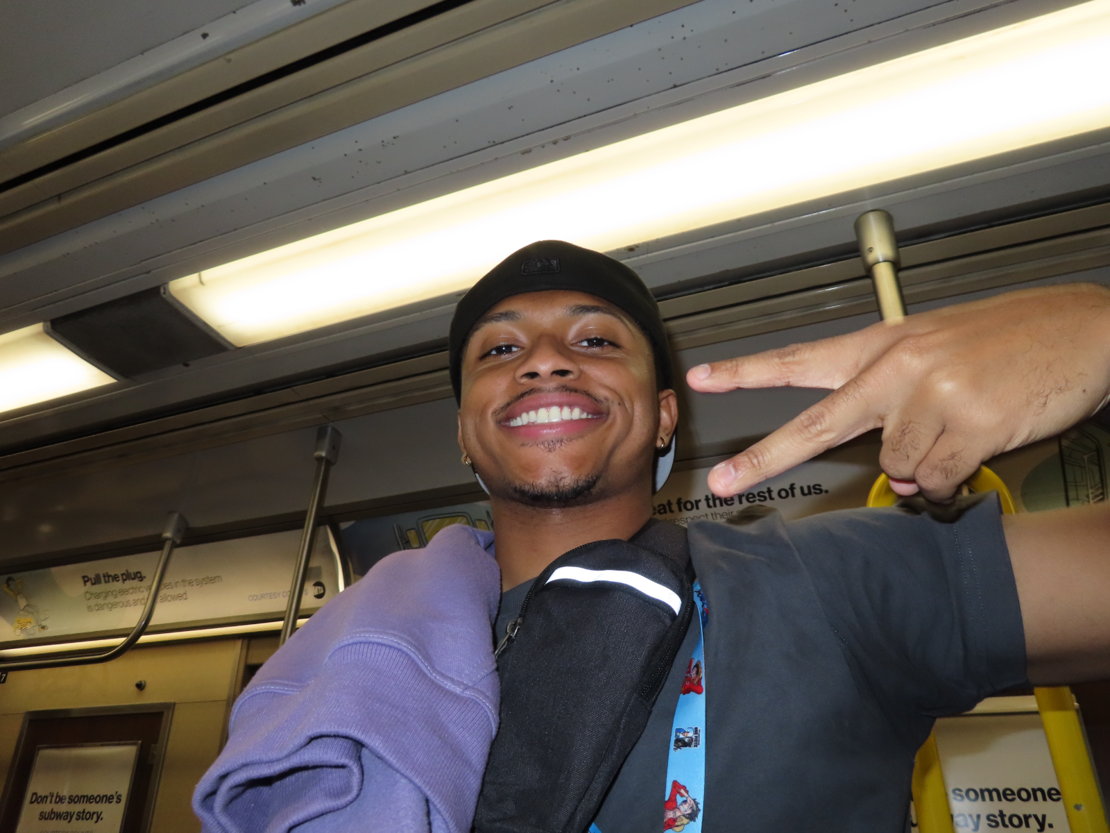 James on the subway home from NY Comic Con